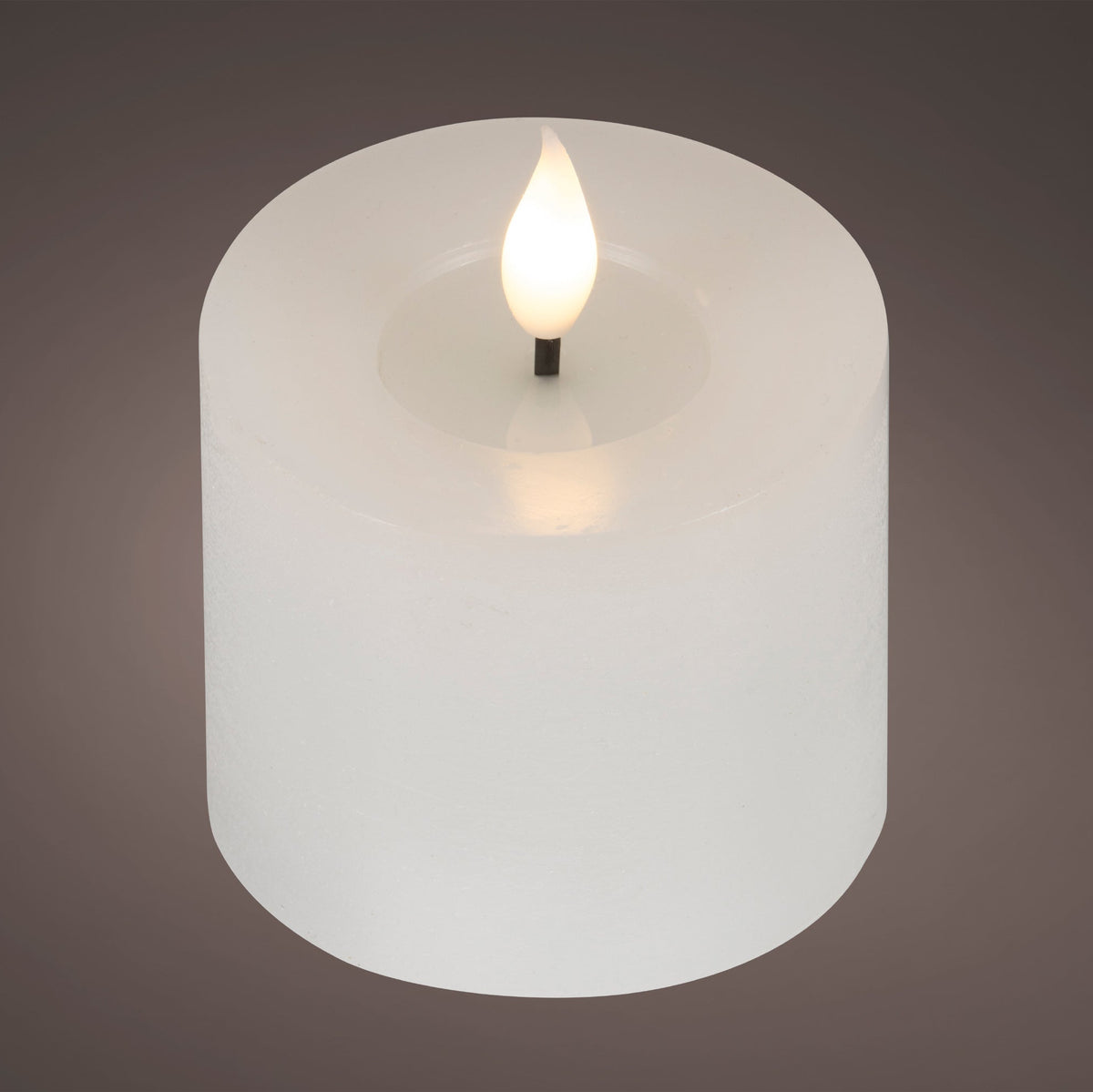 Small white Lumineo LED candle with a realistic warm-white resin wick flame and rustic wax finish