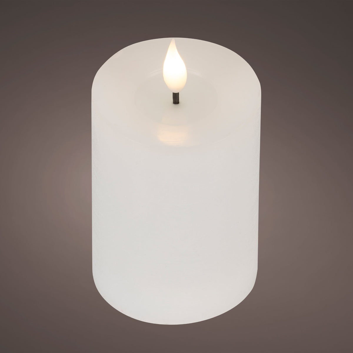 Tall white Lumineo LED candle with a realistic warm-white resin wick flame and rustic wax finish