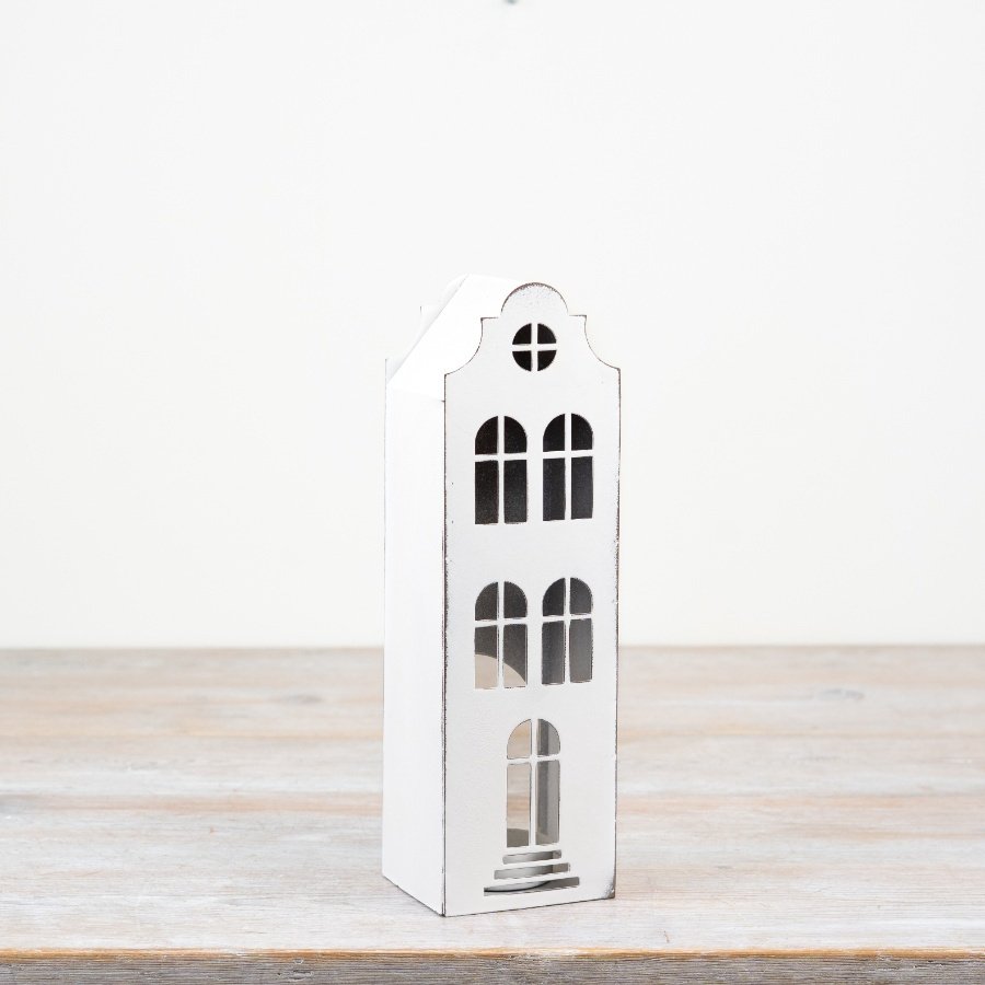 Tall white metal house candle holder with arched windows and stepped gable roof, 26.8cm