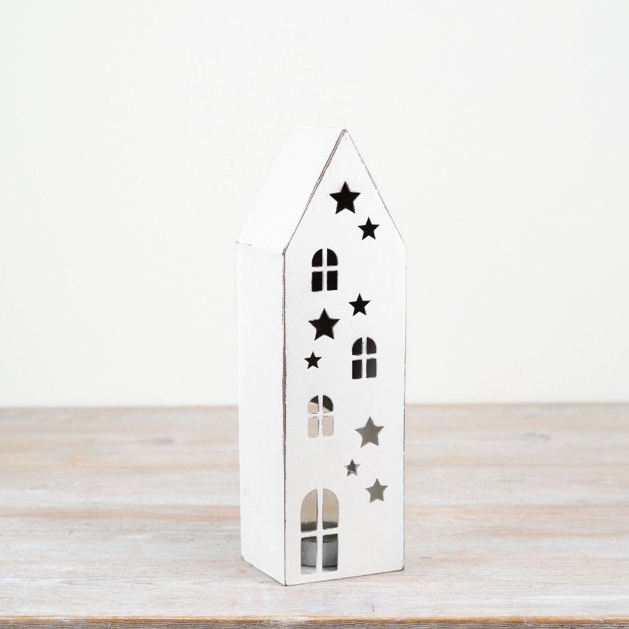Tall white metal house candle holder with star cut-out details and pointed roofline, 37.5cm