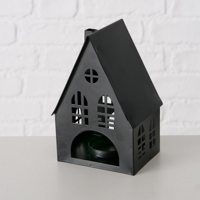 Single medium matte black metal house lantern showing arched window and door cut-out detail