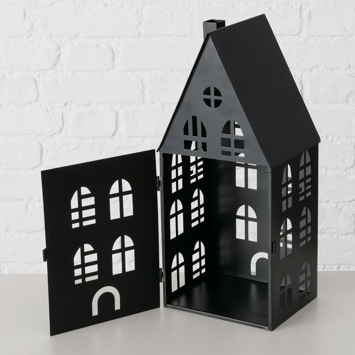 Large matte black metal house lantern with hinged front panel open showing interior tealight holder