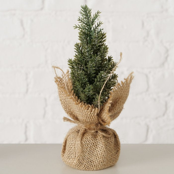 Dark green miniature Christmas tree decoration with a rustic jute-wrapped base