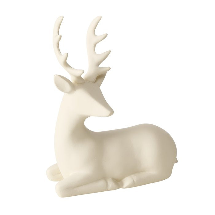 Seated matte cream polyresin reindeer figurine with antlers, 15cm, on white background