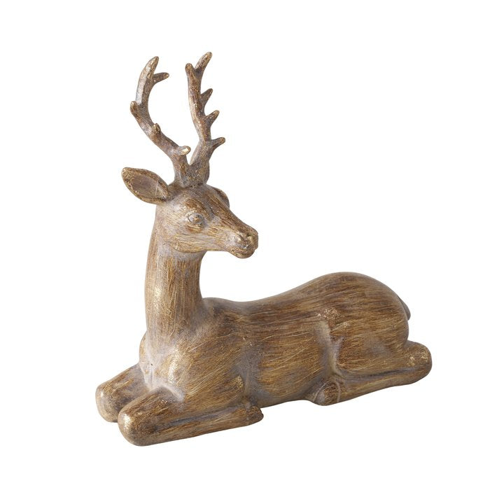 Hand-painted brown Pado deer figurine reclining with its head turned to the side