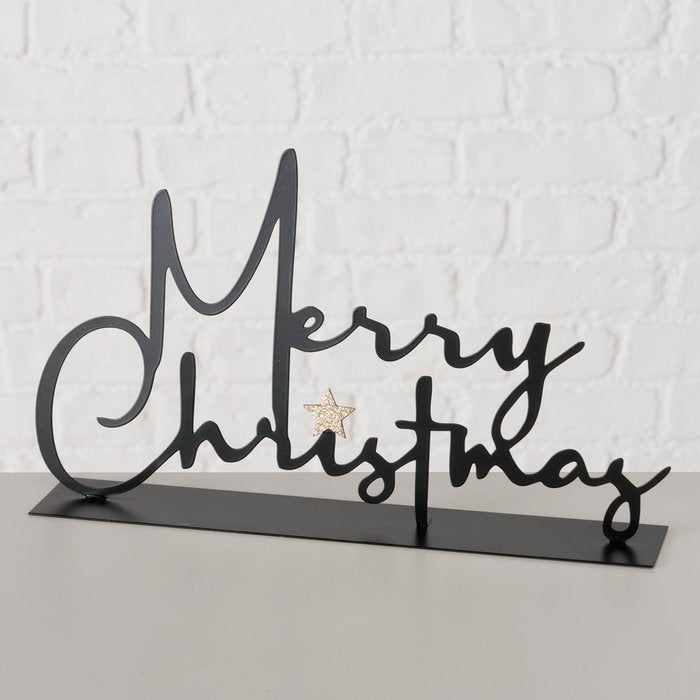 Merry Christmas black powder-coated iron lettering sign with gold star accent on white background