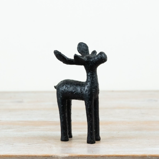 Two black textured rustic moose ornaments with raised antlers, matte black finish, standing on a wooden surface