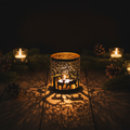 Gold reindeer cut out candle holder glowing warmly in a cosy Nordic Christmas setting