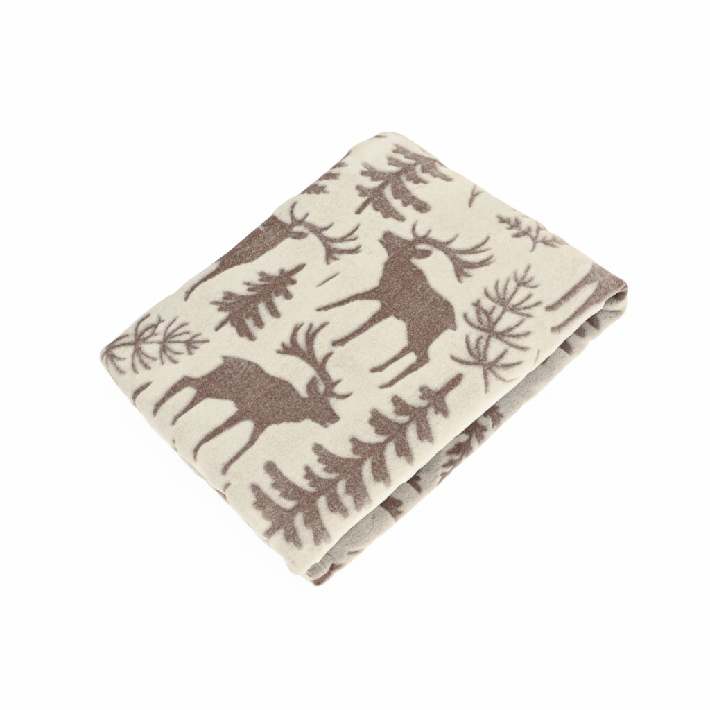 Winter Scene Throw folded, featuring off-white fleece with brown reindeer and pine tree print
